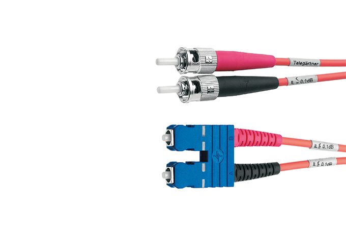 Two fibre optic patch cables in pink and black